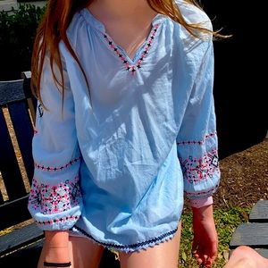 light blue stitched beach shirt.
